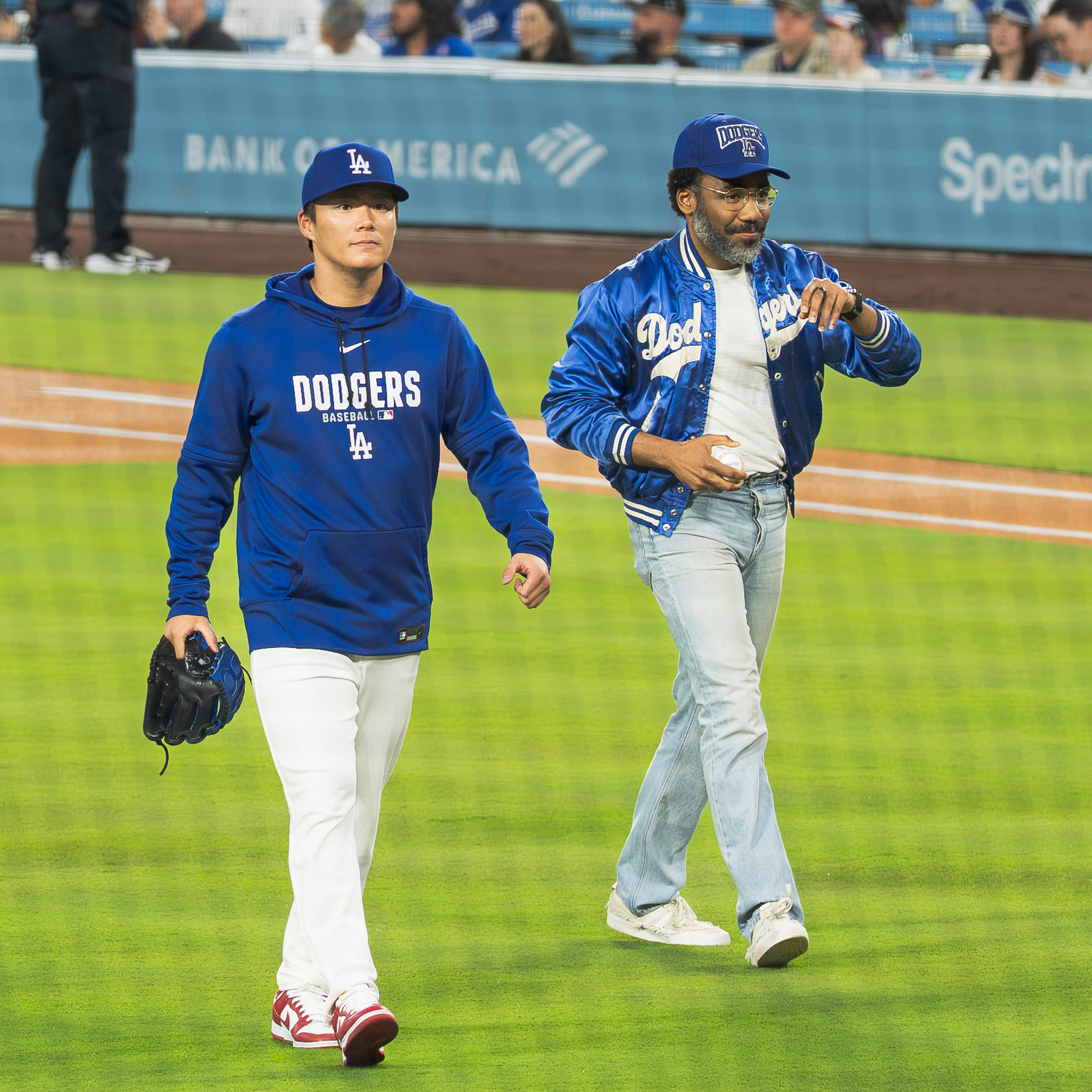 Pitcher Yoshinobu Yamamoto greets Donald Glover for the ceremonial first pitch on Opening Day, 2026